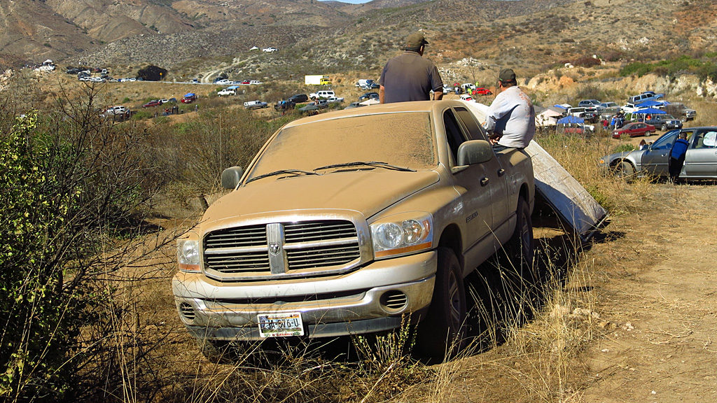 Spectating a desert race is dirty business; these guys didn't bother to roll up the windows.