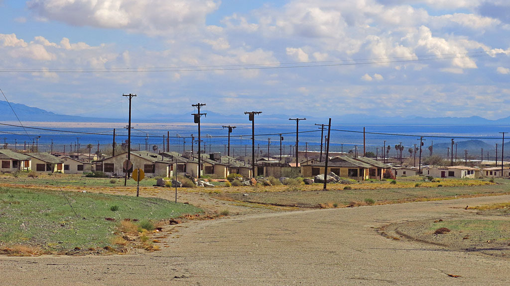 Eagle Mountain was founded in 1948 and had a peak population of 4,000. Wikipedia: "It had wide, landscaped streets lined with over four hundred homes, some with as many as four bedrooms. Two hundred trailer spaces and several boarding houses and dormitories provided living space for Kaiser's itinerant workforce. Other amenities included an auditorium, a park, a shopping center, a community swimming pool, lighted tennis courts, and a baseball diamond. Businesses included a bowling alley, two gas stations, eight churches and three schools."