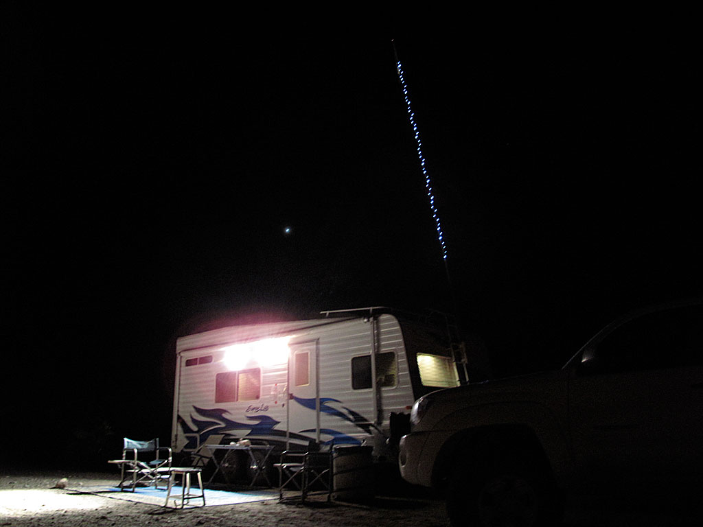 Sting lights on the flagpole aid over-served campers find their way back to camp in the darkness. Sting lights on the flagpole aid over-served campers find their way back to camp in the darkness.
