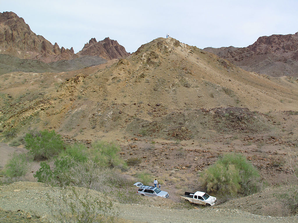 Matt and Carol are at the top of the hill, replacing our weathered geocache container. The location is northwest of Yuma and experiences some brutal summer temperatures. Matt and Carol are at the top of the hill, replacing our weathered geocache container. The location is northwest of Yuma and experiences some brutal summer temperatures.