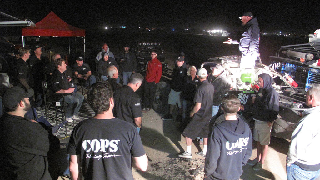 Friday night crew meeting at the COPS' main pit.