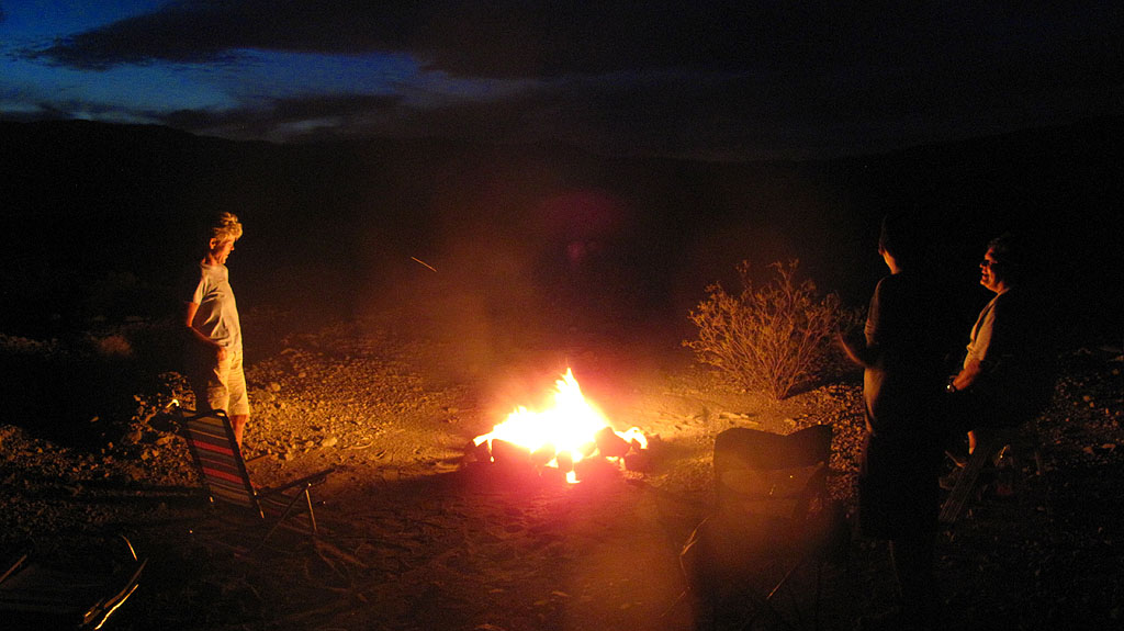 Carol and George get the fire started with the help of a little gasoline. Carol and George get the fire started with the help of a little gasoline.