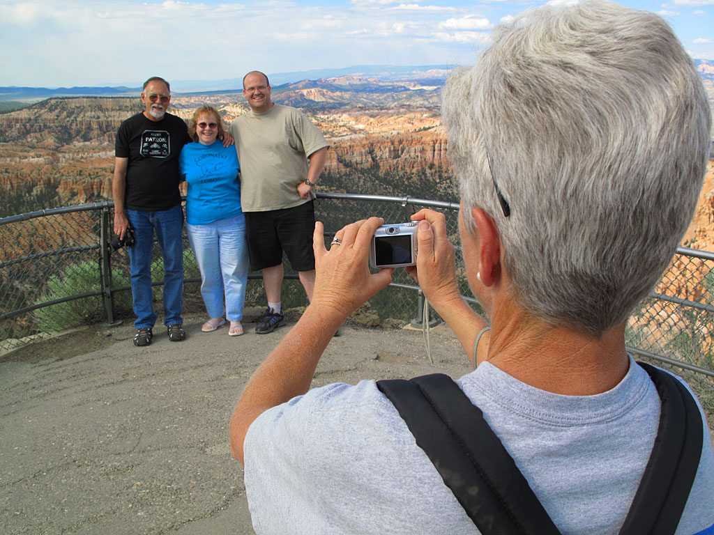 Carol snaps a photo for some tourists. Carol snaps a photo for some tourists.