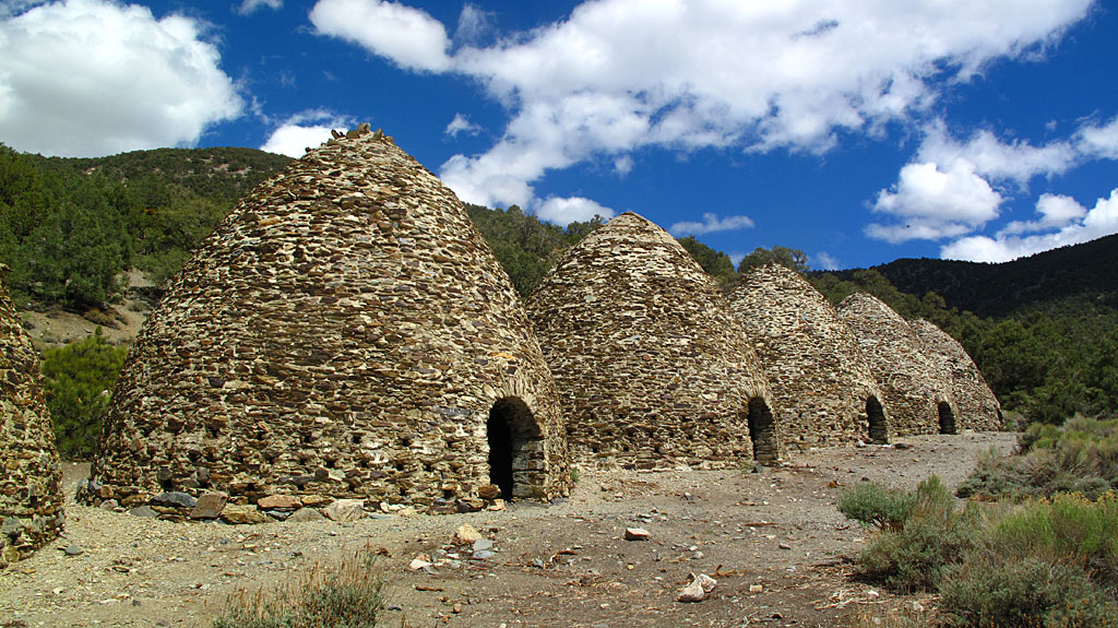 The Charcoal Kilns in Death Valley. These ten beehive shaped masonry structures, about 25 feet high, were completed in 1877 by the Modock Consolidated Mining Company to provide a source of fuel suitable for use in two smelters adjacent to their group of lead-silver mines in the Argus Range west of Panamint Valley, about 25 miles distant from the kilns. The Charcoal Kilns in Death Valley. These ten beehive shaped masonry structures, about 25 feet high, were completed in 1877 by the Modock Consolidated Mining Company to provide a source of fuel suitable for use in two smelters adjacent to their group of lead-silver mines in the Argus Range west of Panamint Valley, about 25 miles distant from the kilns.