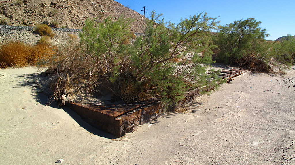 An old, buried boxcar in Afton Canyon, just below the train tracks. An old, buried boxcar in Afton Canyon, just below the train tracks.
