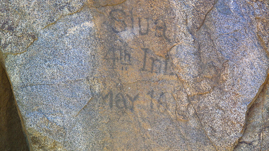 Old graffito at Ft. Rock Springs. There's also numerous Indian petroglyphs nearby. Old graffito at Ft. Rock Springs. There's also numerous Indian petroglyphs nearby.