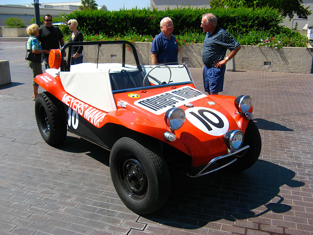 Bruce Meyers stands next to the revolutionary Meyers Manx. It was produced by his Fountain Valley, California company from 1964 to 1971, in the form of car kits applied to shortened chassis of Volkswagen Beetles. Bruce Meyers stands next to the revolutionary Meyers Manx. It was produced by his Fountain Valley, California company from 1964 to 1971, in the form of car kits applied to shortened chassis of Volkswagen Beetles.