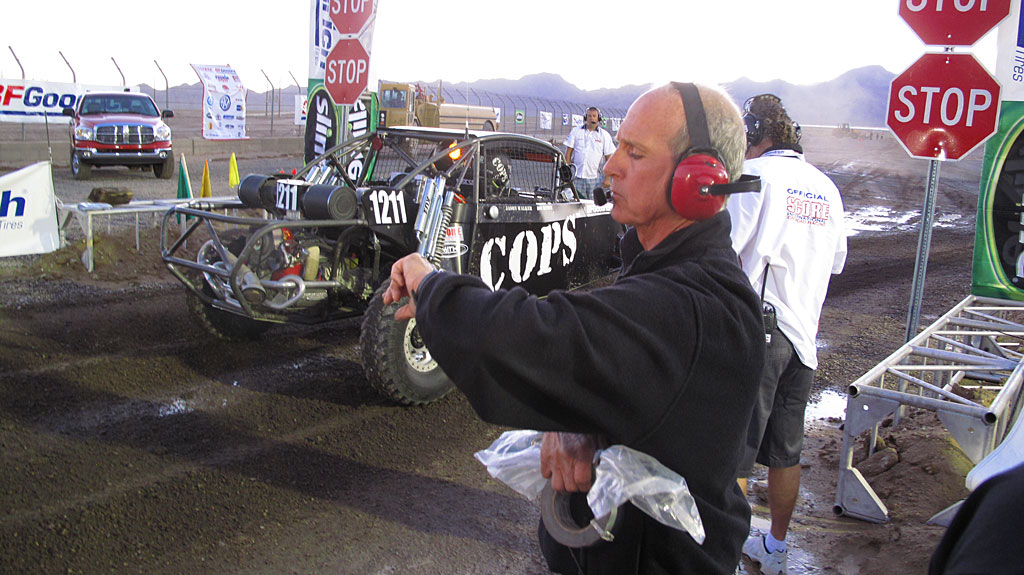 Joe Taylor, COPS Crew Chief, sees the Class 12 car off the starting line. Joe Taylor, COPS Crew Chief, sees the Class 12 car off the starting line.