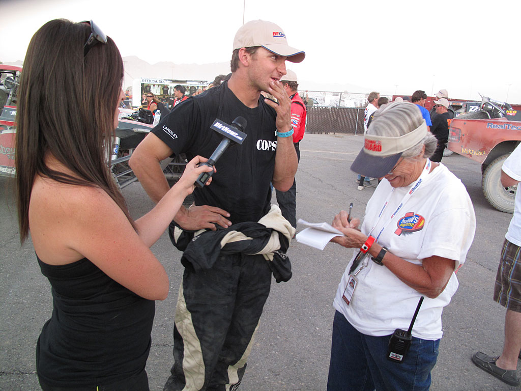 Smith is interviewed at the finish by the media after a well-run race. Smith is interviewed at the finish by the media after a well-run race.