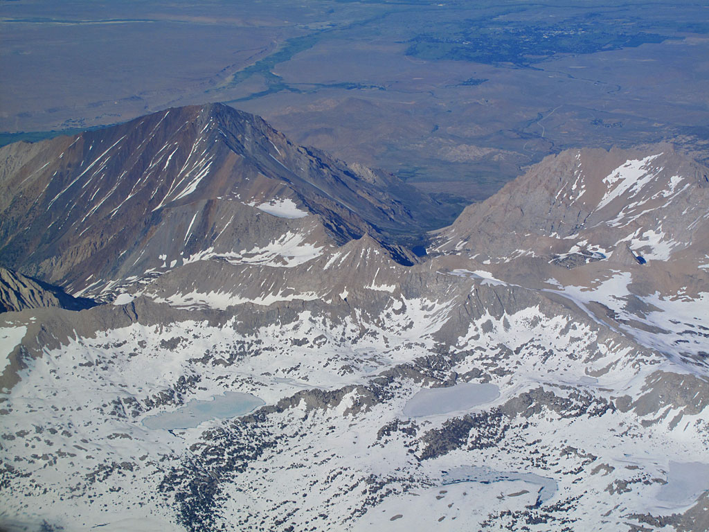 The green patch in the background is Bishop; the mountain on the left is Mt. Tom, the smaller one on the right is Basin Mountain - in between is Horton Lake. The green patch in the background is Bishop; the mountain on the left is Mt. Tom, the smaller one on the right is Basin Mountain - in between is Horton Lake.