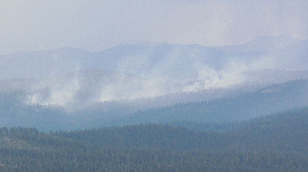 Minutes before we arrived at the Bald Mountain LO, a nearby wildfire had erupted. The ranger told us that little fires like this are fairly common during the summer months. Many times, the fires are so remote and non-threatening, that they're left alone, to burn out on their own. Minutes before we arrived at the Bald Mountain LO, a nearby wildfire had erupted. The ranger told us that little fires like this are fairly common during the summer months. Many times, the fires are so remote and non-threatening, that they're left alone, to burn out on their own.Minutes before we arrived at the Bald Mountain LO, a nearby wildfire had erupted. The ranger told us that little fires like this are fairly common during the summer months.
