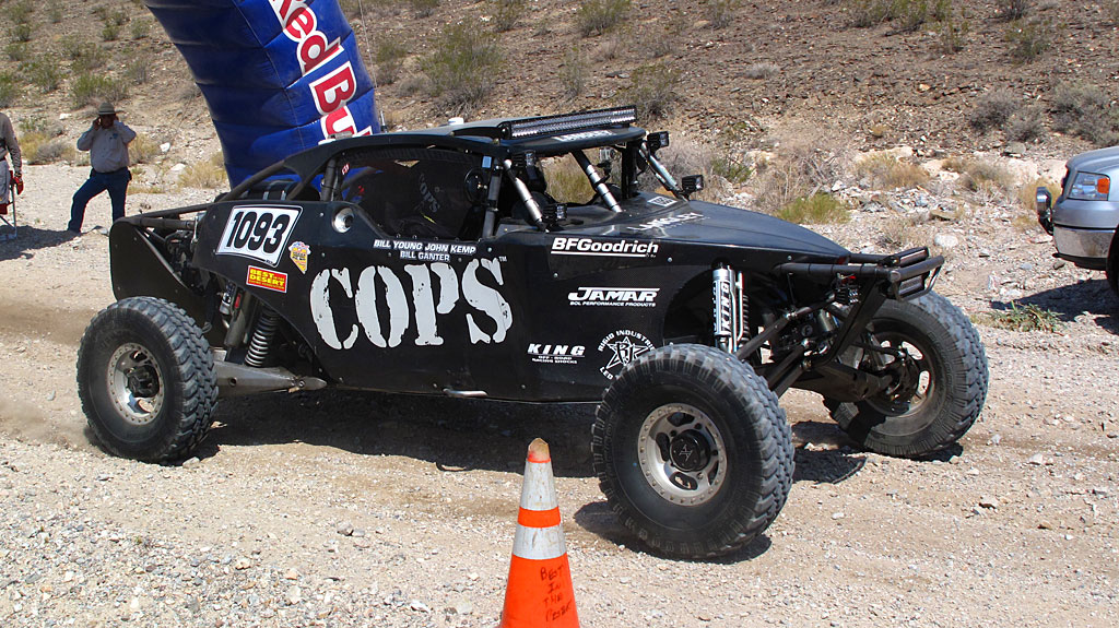 John Langley started the COPS Class 10 in the V2R race. Fifty miles later, he would collide with an overturned race car hidden in dust, taking the COPS car out of the race. John Langley started the COPS Class 10 in the V2R race. Fifty miles later, he would collide with an overturned race car hidden in dust, taking the COPS car out of the race.
