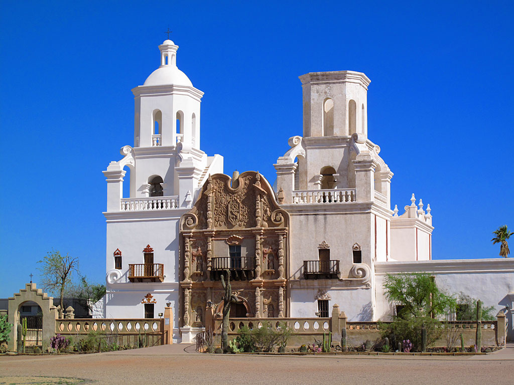 Mission San Xavier del Bac is a historic Spanish Catholic mission located about 10 miles south of downtown Tucson. Mission San Xavier del Bac is a historic Spanish Catholic mission located about 10 miles south of downtown Tucson.