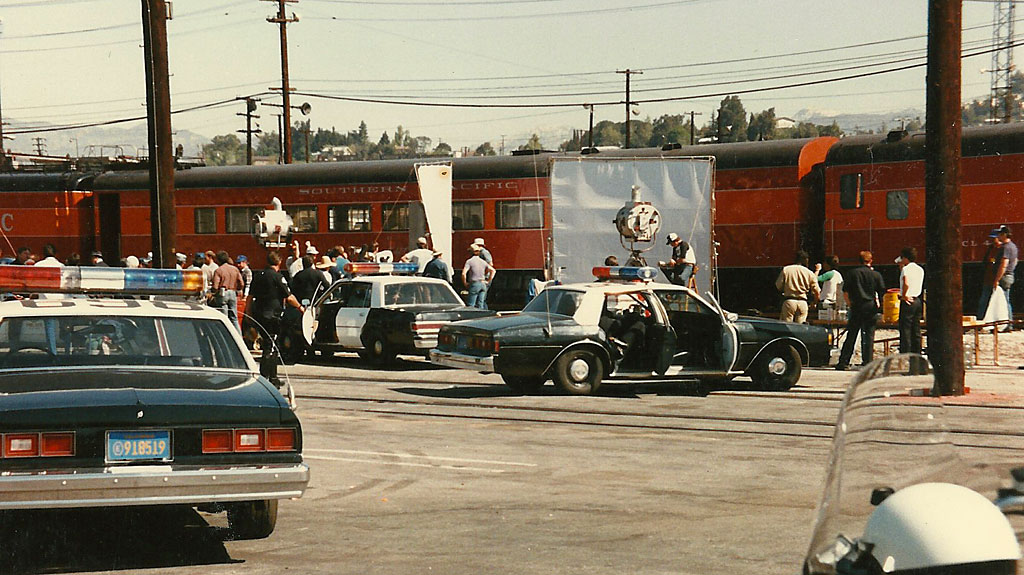 Filming a police shoot-out while Burt Lancaster and Kirk Douglas hang out the door of the baggage car.