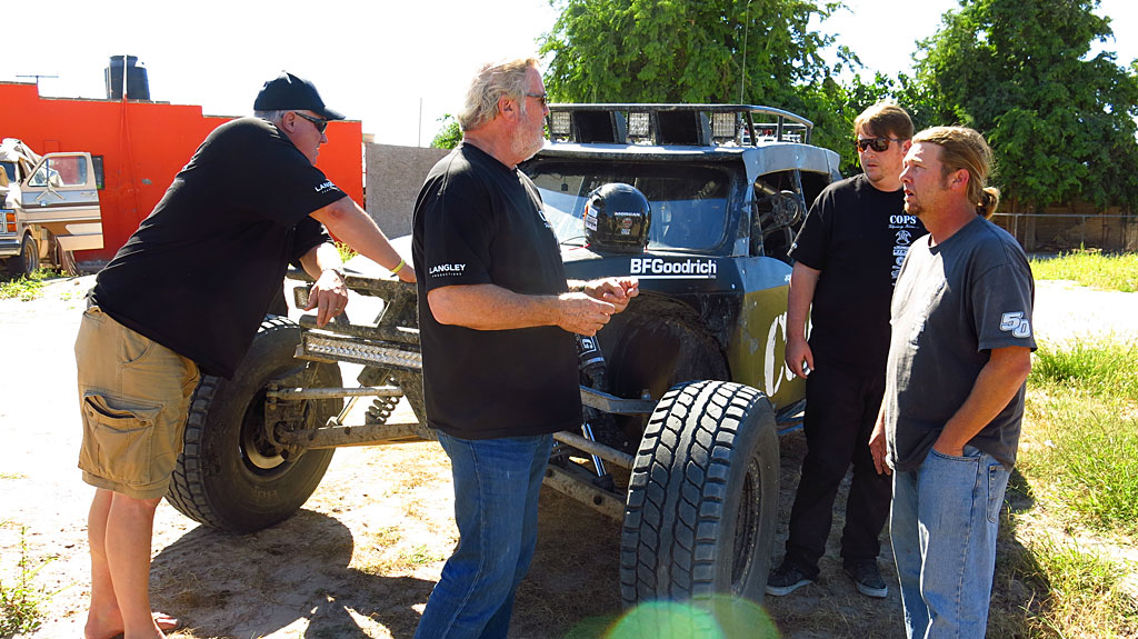 John Langley, Team Owner, discusses the day's logistics with Morgan and Bill.
