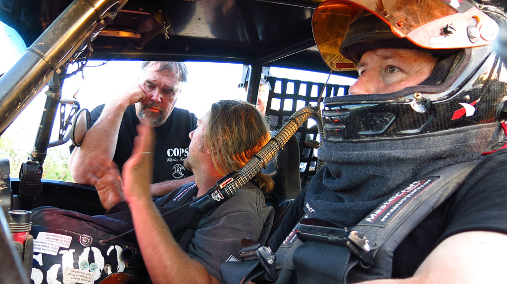 Bill and Morgan describe some minor mechanical issues to Dennis, the team's "Chaseman."