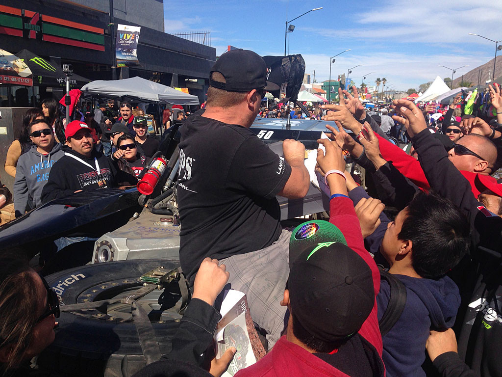Handing out hats (or other free stuff) creates a frenzied excitement among spectators.
