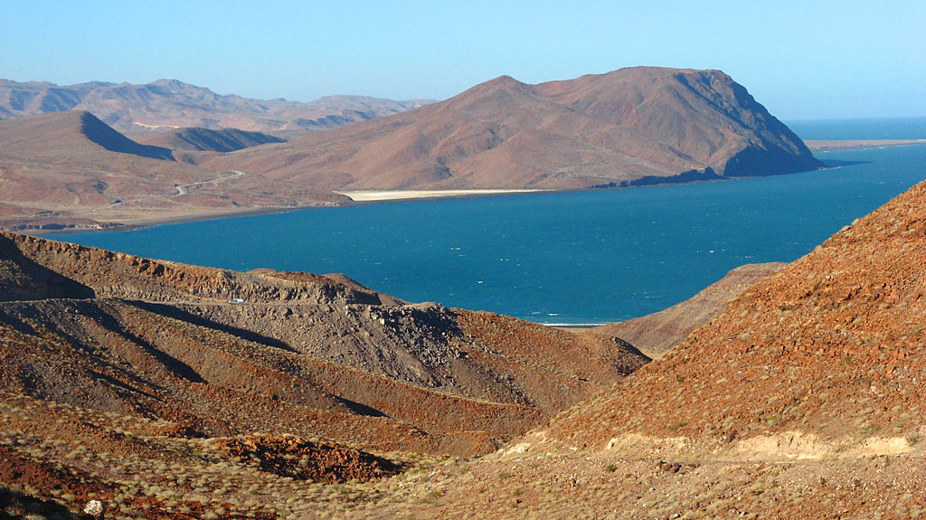 The road climbing Cuesta de Araiza along the Sea of Cortez - Volcan Prieto in the background.