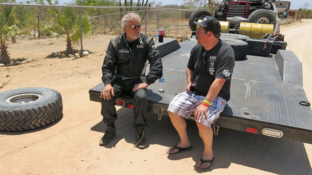 John waits for his truck's wheel bearing to be swapped out. Including the time required to locate him, and mechanical repairs, his down-time was close to two hours. Even with the down-time, he would finish seventh in class.