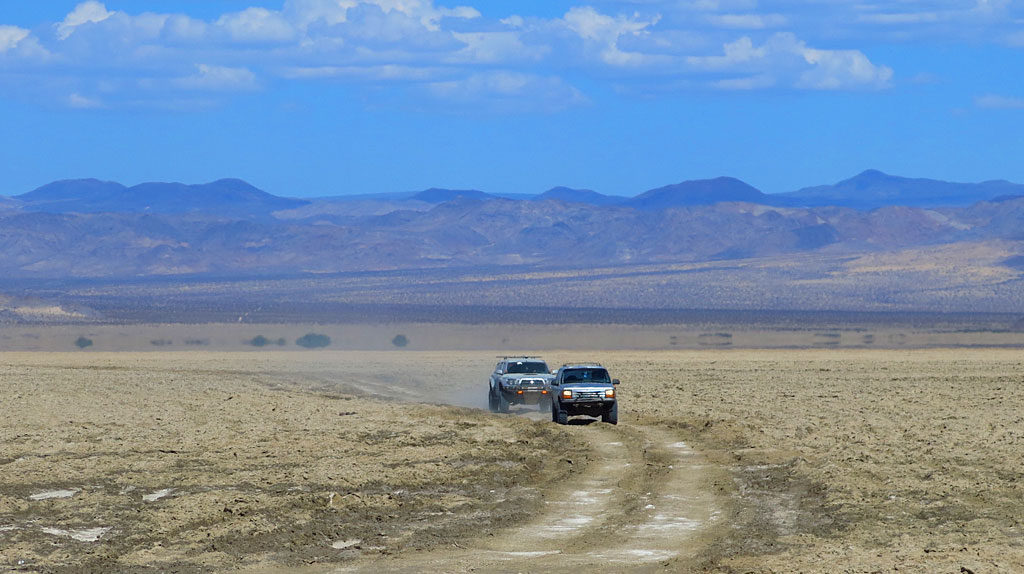 Dennis and Bob cross six-mile-wide Soda Lake. When settlers traveled the Mojave Road in the 1860s, the Mojave River still flowed through here - it has since receded, mostly into Afton Canyon.