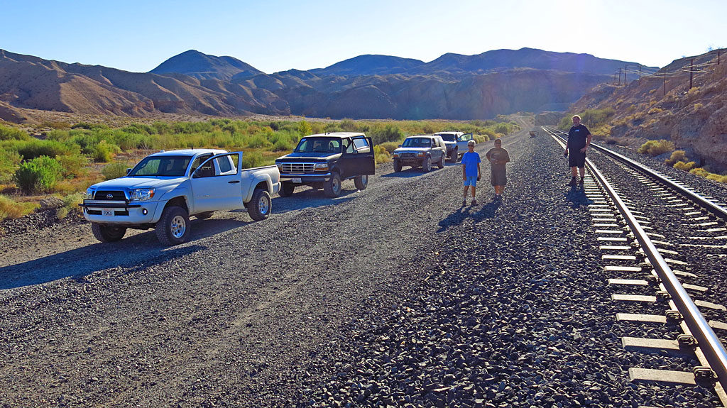 Tourists gawking at the Bighorn Sheep. Oh, and by the way, a train is coming.