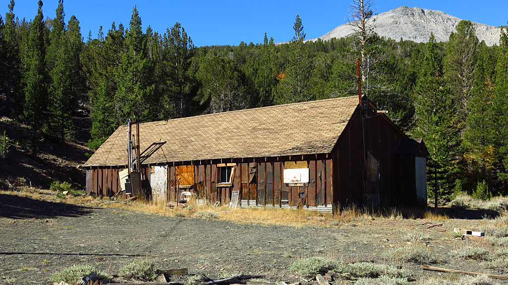Buildings at the Log Cabin Mine are amazingly preserved - glass in windows, with lighting fixtures, equipment, and machinery. This large building was the mess hall, below Mt. Warren.