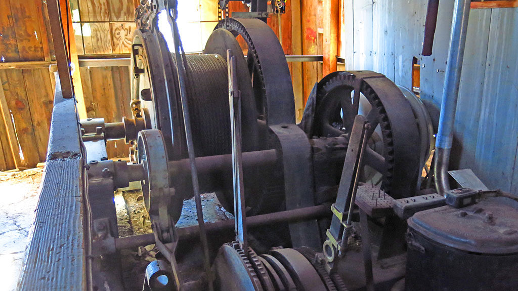 Inside the hoist building is a large single-drum hoist -- the motor, the electrical equipment and controls, even the operator’s chair, are all still there.
