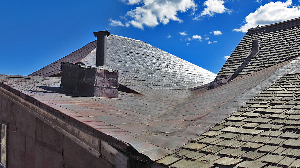 Empty tin cans converted into roofing material -- most likely, a hot tin roof.