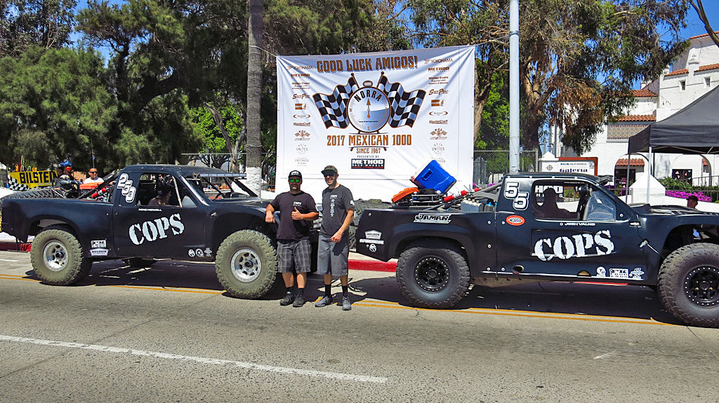 For the 2017 Mexican 1000, COPS Racing campaigned two trucks: Zak Langley and Josh Valko will pilot the #55 Trophy Truck, while somewhere back in the dust, John Langley and Mike Howell will be in the Trophy Spec #250. That's COPS Crew Chief Mike Meehan with Josh escorting the trucks through Contingency and Tech.