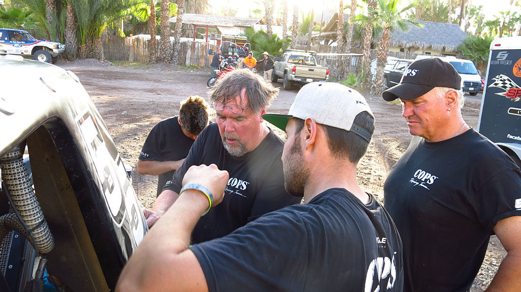 Dennis and Josh make repairs to the #55's rear fender hanger which was severely damaged during a tire blow-out.