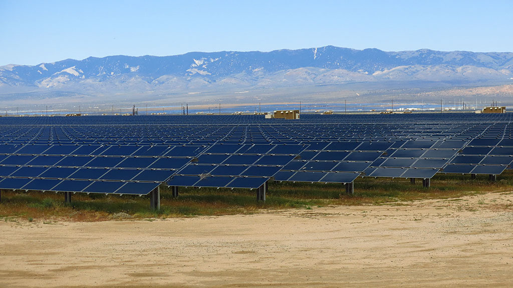 Many, many-acre solar voltaic panels line both sides of CA-138.
