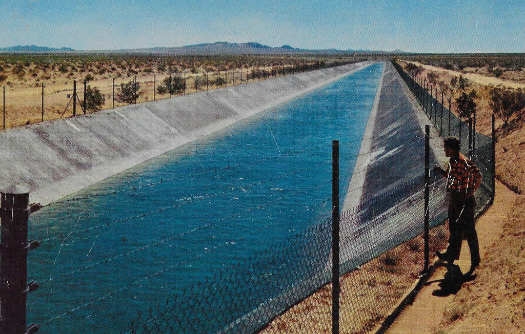 On back: This great Colorado River aqueduct carries the precious water that is the very life's blood of Southern California. This marvel of engineering crosses hundreds of miles of arid deserts and mountains before reaching Southern California. It passes across the desert a few miles north of Palm Springs.