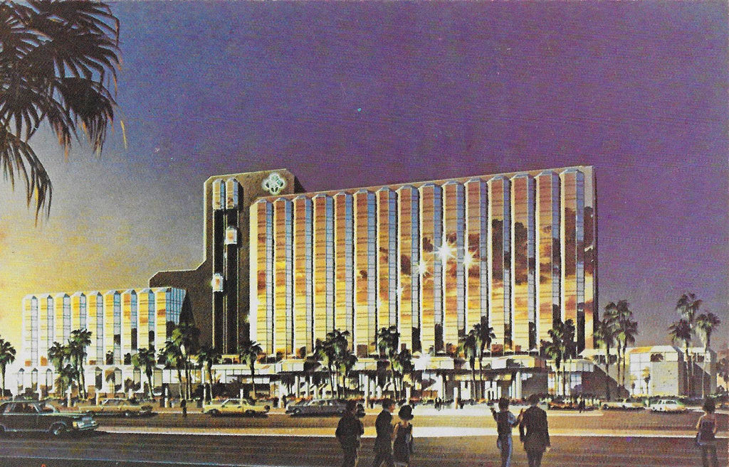 On back: FUTURE LOOK ... Artist's rendering depicts the future look of the all new Desert Inn and Country Club. When completed, the resort will house a spacious new casino and lavish shops and luxurious restaurants. Completion scheduled for mid-1978.
