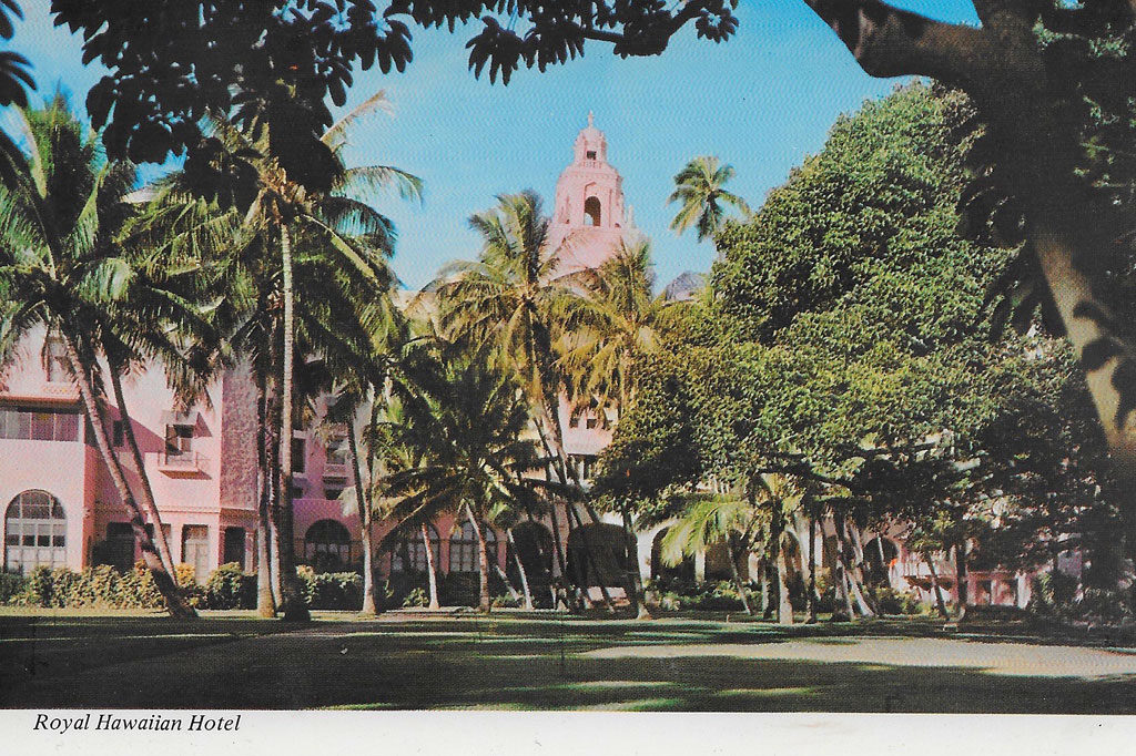 On back: Although one of the older hotels in Waikiki, its unique architecture, surrounded by lush tropical foliage and famed Waikiki Beach at its back makes this Sheraton Hotel a favorite of many notables.