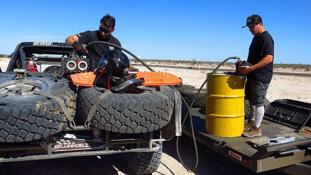 Josh and Mark fueling the prerunners at the same place the race trucks will take on fuel during the race: the future location of BFGoodrich Pit #8 at Santa Rita, Race Mile 1013.