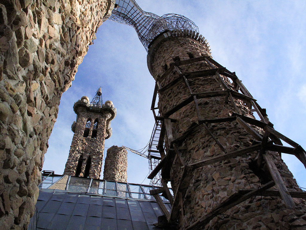 The main tower of the castle is 160' tall (left of center). On the right, a temporary wooden scaffolding is in place for exterior work.
