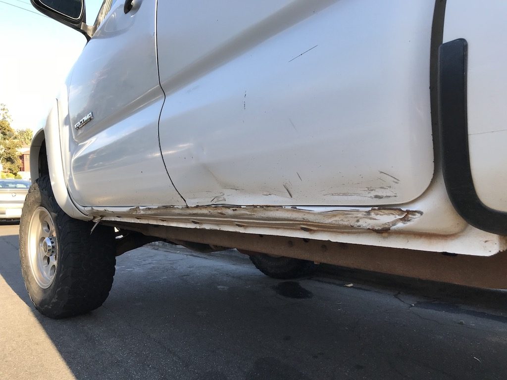 Rock damage under the driver-side doors